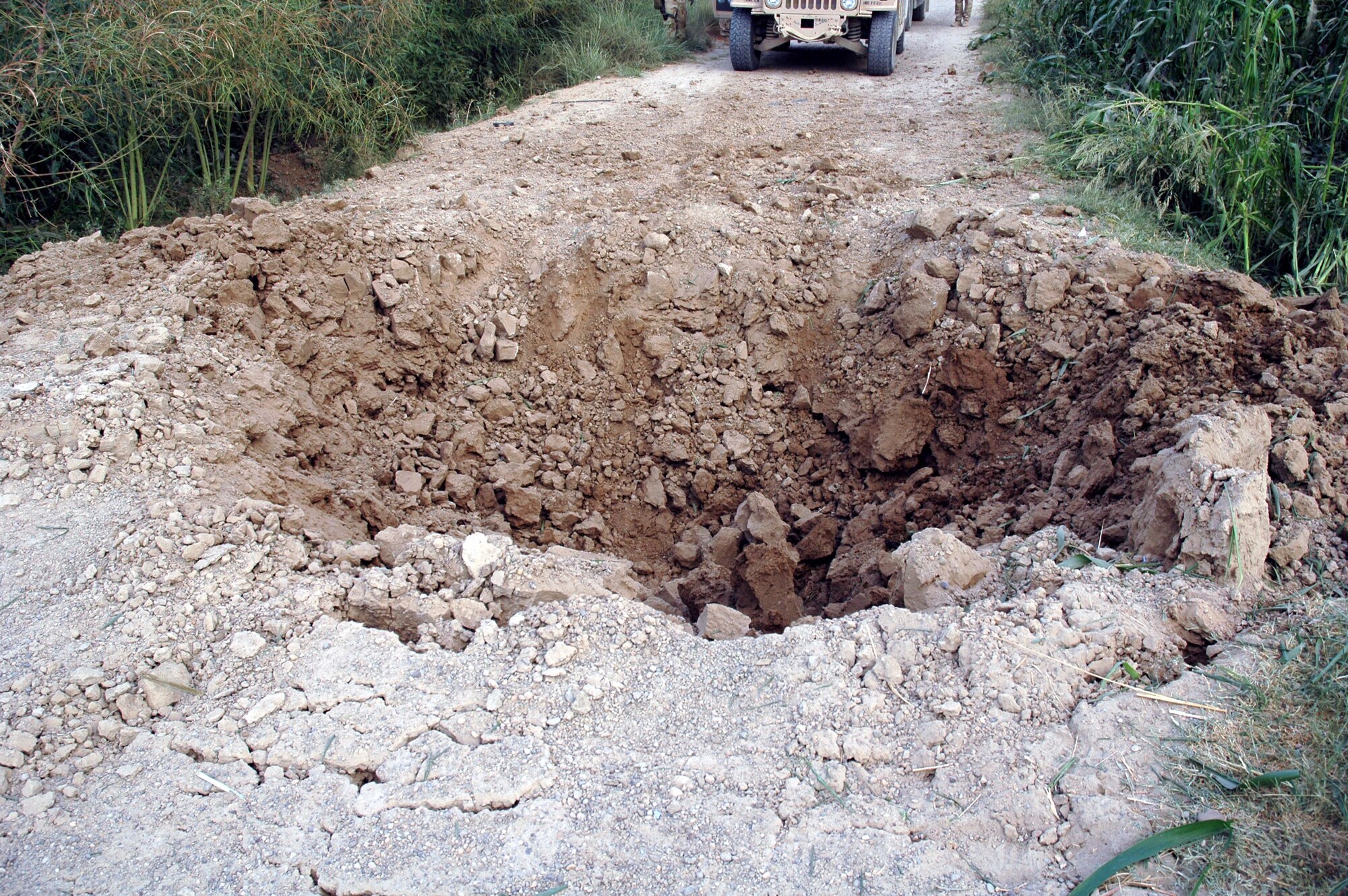 This crater was caused by the explosion that flipped the HMMWV Sergeant Horton was in. The IED was estimated to be about a 110lb. device. Sergeant Horton suffered a fractured disk in his back and a ruptured ear drum from the explosion. However, Sergeant Horton and his team were still able to engage the enemy forcing them to retreat. He was back doing his job within nine days, and was again injured by a Rocket Power Grenade explosion less than a month later. (Courtesy photo)
