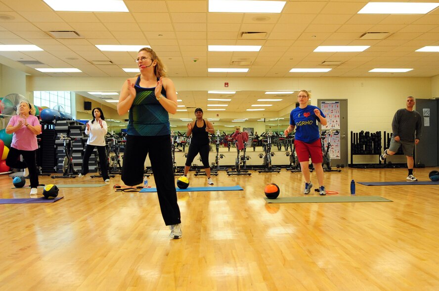 Participants in the Barksdale Fitness Center’s body sculpting class warm-up prior to beginning their work-out on Barksdale Air Force Base, La., Feb. 10. The body sculpting class utilizes body bars, medicine and stability balls and free weights to tone the core. (U.S. Air Force photo by Senior Airman Joanna M. Kresge)