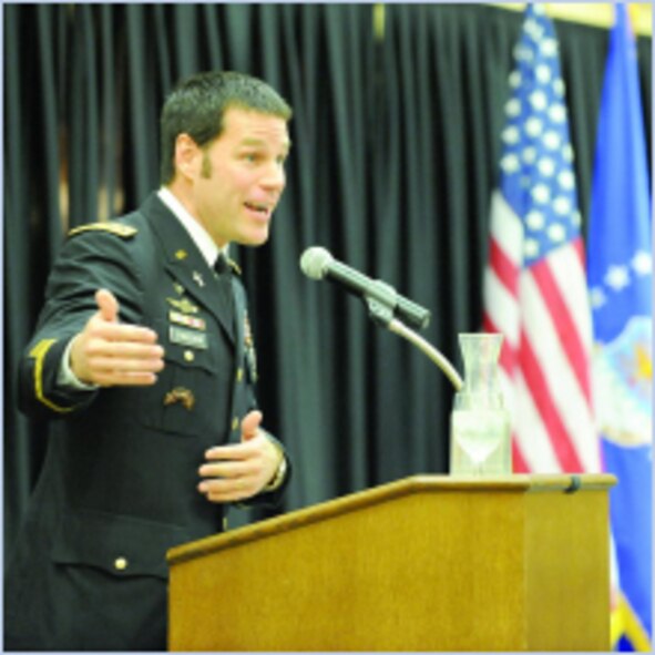 Chaplain (Maj.) Jeff Streucker, U.S. Army (Ret.) speaks to those assembled at the National Day of Prayer Breakfast at Club Hill about his experiences in the 1993 Battle of Mogadishu and how prayer influenced his actions there. (U.S. Air Force photo by Alex Lloyd)