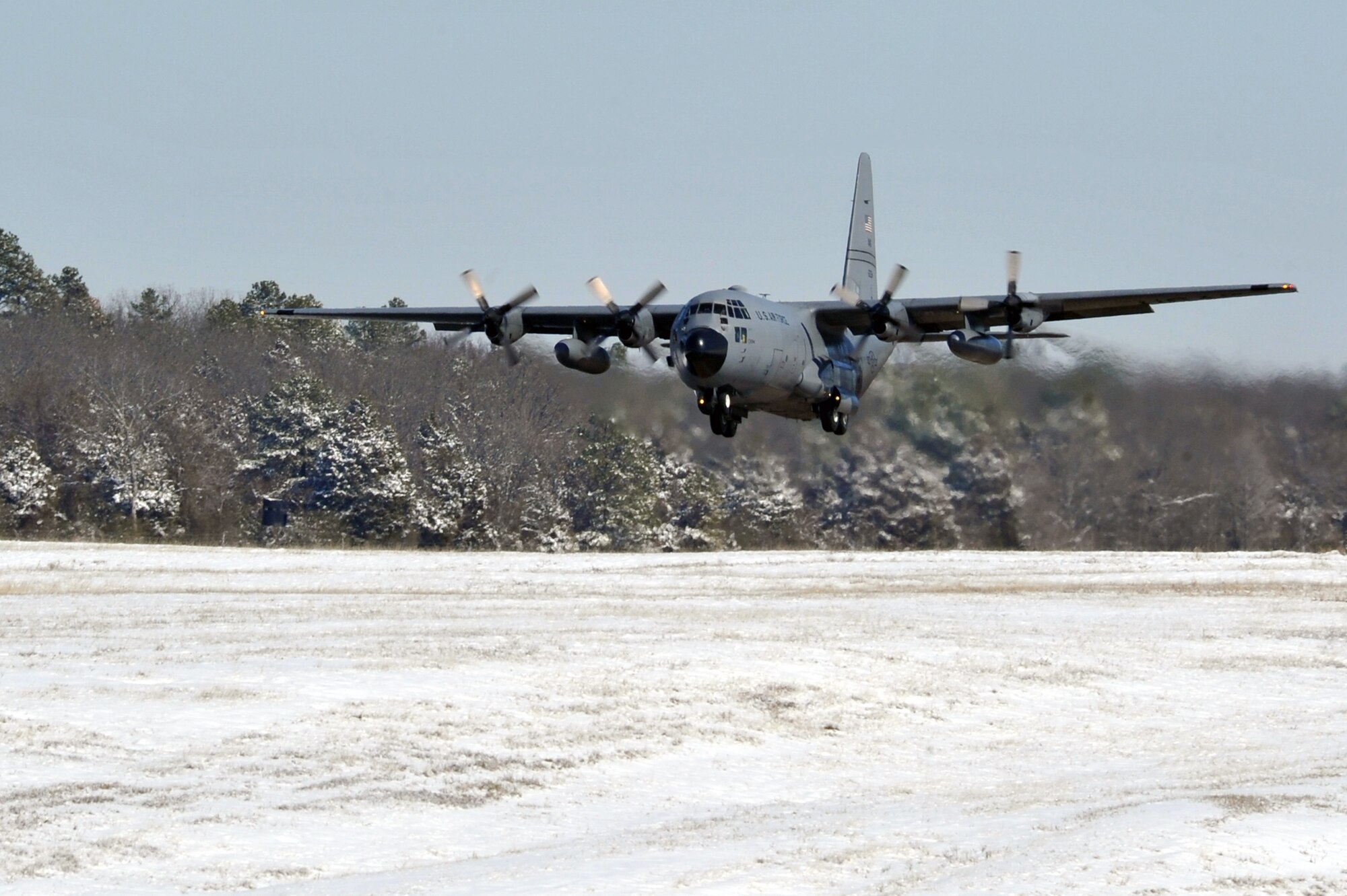 A C-130 Hercules takes off from the flightline Feb. 10, 2011, at Little Rock Air Force Base, Ark. Due to the efforts of numerous Team Little Rock members, the flightline was clear for continued base operations. (U.S. Air Force photo by Staff Sgt. Chris Willis)