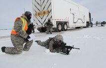 MINOT AIR FORCE BASE, N.D. -- Senior Airman Brian Bond, 791st Missile Security Forces Squadron fire team member, responds to evaluators on his specific duties as part of a training exercise during Prairie Sentry 11-2 here Feb. 2.  Exercises like this give Air Force Global Strike Command Airmen the opportunity to maintain their combat operation skills. (U.S. Air Force photo/Senior Airman Michael J. Veloz)