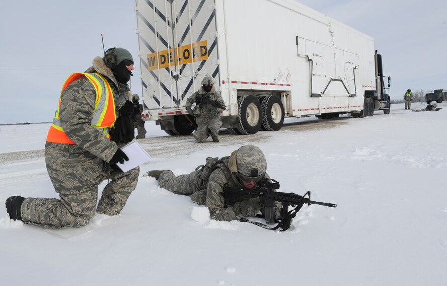 MINOT AIR FORCE BASE, N.D. -- Senior Airman Brian Bond, 791st Missile Security Forces Squadron fire team member, responds to evaluators on his specific duties as part of a training exercise during Prairie Sentry 11-2 here Feb. 2.  Exercises like this give Air Force Global Strike Command Airmen the opportunity to maintain their combat operation skills. (U.S. Air Force photo/Senior Airman Michael J. Veloz)