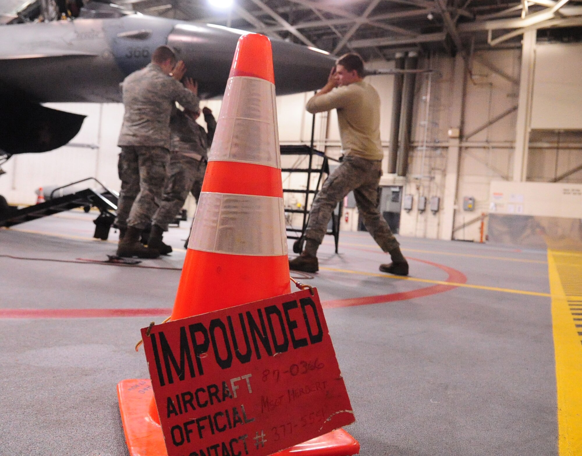 Avionic Airmen work on the radar portion of an impounded F-16 Fighting Falcon Feb. 8, 2011 Eielson Air Force Base, Alaska.  The aircraft is being put through a rigorous set of testing.  The Airmen are assigned to the 354th Aircraft Maintenance Squadron. (U.S. Air Force photo/Airman 1st Class Laura Goodgame)