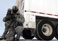 MINOT AIR FORCE BASE, N.D. -- Senior Airman Matthew Pavlik, 791st Missile Security Forces Squadron fire team member, provides supporting security at the rear of a payload transporter as part of a training exercise during Prairie Sentry 11-2 here Feb. 2.  Exercises like this give Air Force Global Strike Command Airmen the opportunity to maintain their combat operation skills keen. (U.S. Air Force photo/Senior Airman Michael J. Veloz)