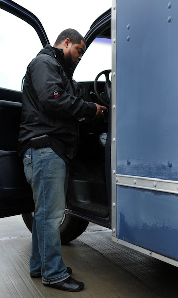 MOODY AIR FORCE BASE, Ga. -- Chris Moore, contracted worker, enters a vehicle identification number into a system in order to make an item unique identification label Feb. 10. This marking effort is an Air Force-wide project to help keep accountability of all equipment and prevent loss of assets. (U.S. Air Force photo/Airman 1st Class Douglas Ellis)(RELEASED)
