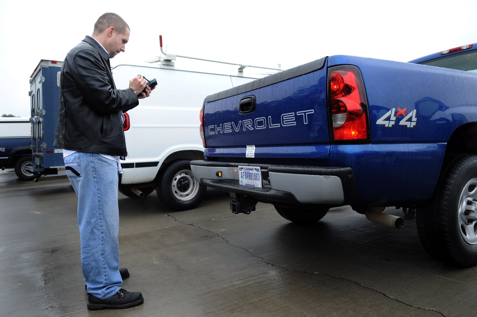 MOODY AIR FORCE BASE, Ga. -- Donald Crosby, contracted worker, types a vehicle’s license plate number into a hand-held electronic device in order to make an item unique identification tag Feb. 10. There will be approximately 500 vehicles marked with the tags as part of an Air Force-wide project to help keep accountability of all equipment and prevent loss of assets. (U.S. Air Force photo/Airman 1st Class Douglas Ellis)(RELEASED)

