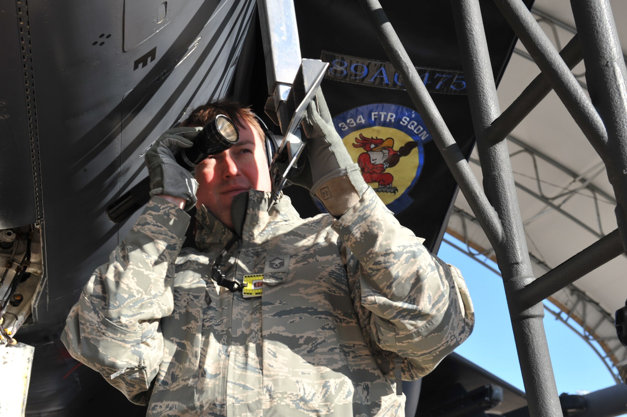 SEYMOUR JOHNSON AIR FORCE BASE, N.C. – Master Sgt. Michael Gregory evaluates an F-15E Strike Eagle internal boarding ladder on the flightline during the Logistics Compliance Assessment Program inspection here, Feb. 9, 2011.  The LCAP team, from Langley AFB, Va., inspects all lead major commands to ensure each unit meets requirements listed in their specific Air Force Instructions. Sergeant Gregory is a Logistics Compliance Assessment Team augmentee. (U.S. Air Force photo/Senior Airman Whitney Lambert) (RELEASED)