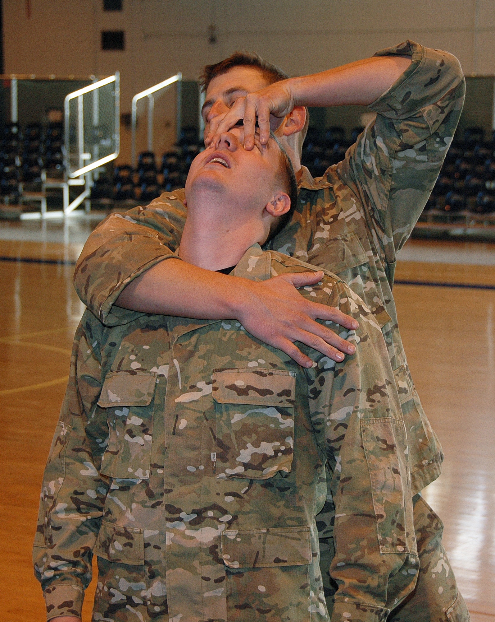 Staff Sergeant Chad Braunschweig, SERE Specialist with the 908th Operations Group, assisted by fellow specialists and civilian contractors, recently conducted combat survival training for members of the 908th Airlift Wing. Above, Staff Sgts. Bryan Smith and Joseph Whitfield of the 22nd TRS demonstrate close combat techniques. (Air Force photo by Tech. Sgt. Jay Ponder)