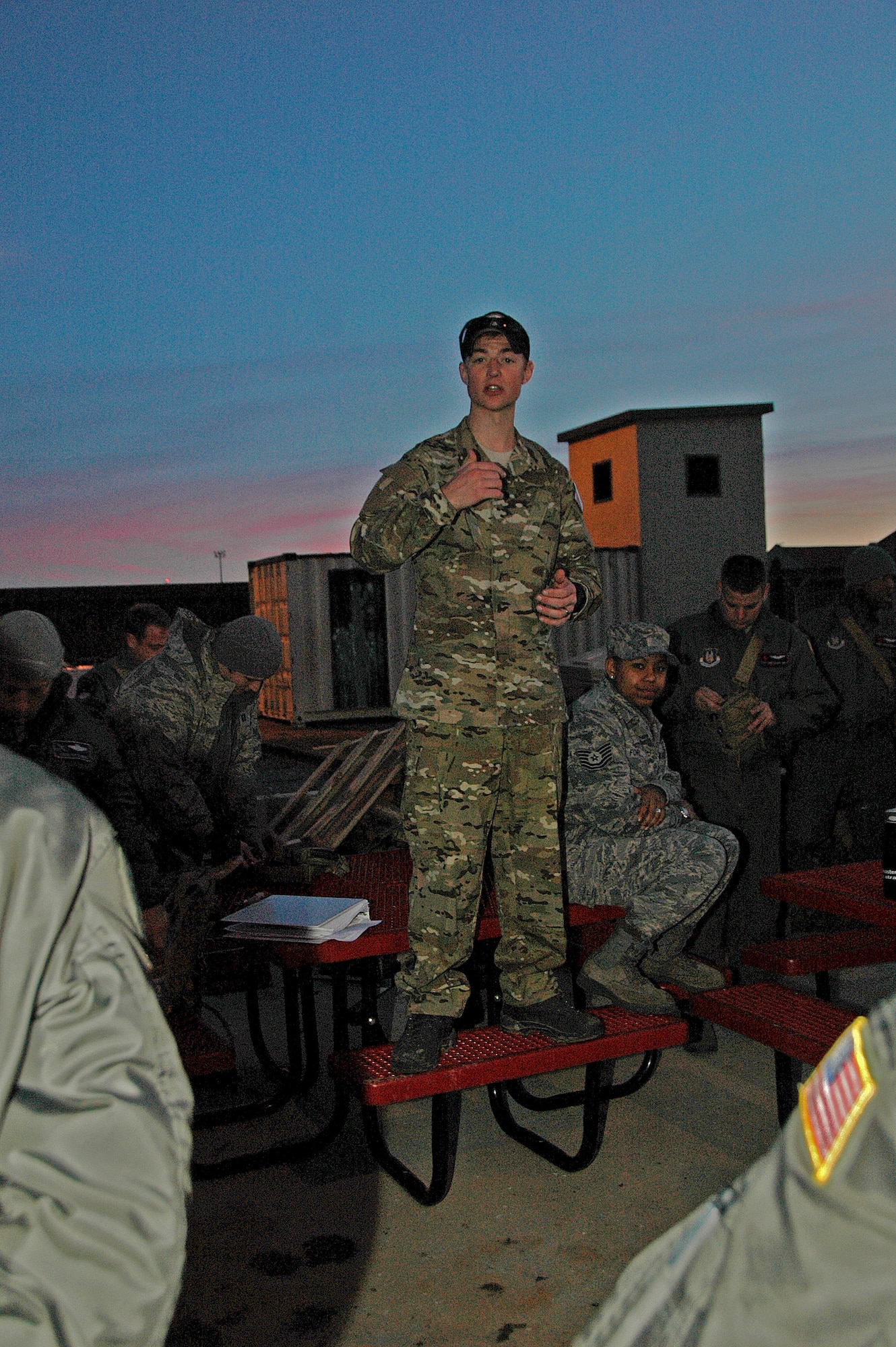 Staff Sergeant Chad Braunschweig, SERE Specialist with the 908th Operations Group, assisted by fellow specialists and civilian contractors, recently conducted combat survival training for members of the 908th Airlift Wing. Above, Sergeant Braunschweig briefs wingmen prior to the night escape and evasion course. (Air Force photo by Tech. Sgt. Jay Ponder)