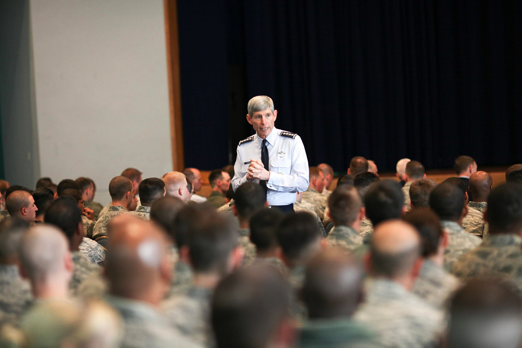 Air Force Chief of Staff Gen. Norton Schwartz talks with more than 600 Airmen during an Airman's call Feb. 8, 2011 at Yokota Air Base, Japan. The general spoke about his priorities for the service and fielded questions about issue affecting the Air Force in 2011. (U.S. Air Force photo/Airman 1st Class Lynise Nichols)
