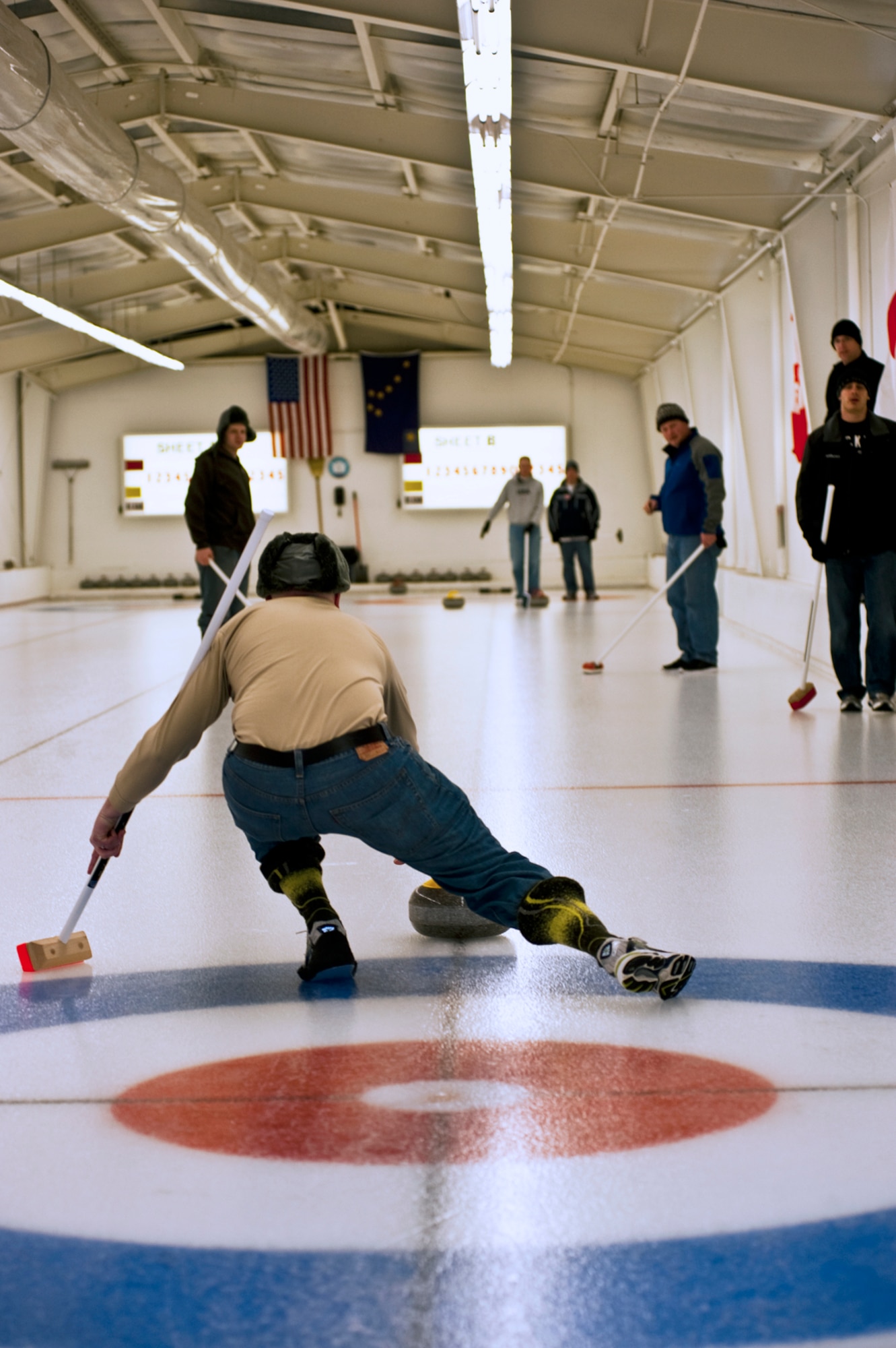 ANCHORAGE, Alaska ? A members of an Air Force Curling team delivers their stone down the ice. The Canadian team went to the finals of the Top Rock tournament in Anchorage to lose to the Air National Guard team. (U.S. Air Force photo/ Airman 1st Class Jack Sanders)