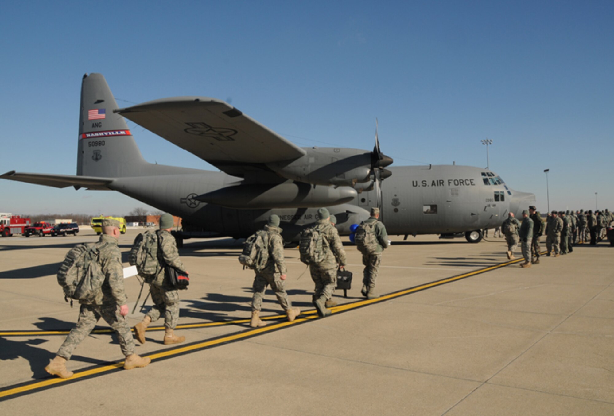 178 FW SFS members prepare to load on a C-130 Hercules for training prior to deploying to Iraq in support of Operation New Dawn Jan. 4.