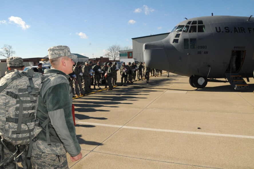 178 FW SFS members prepare to load on a C-130 Hercules for training prior to deploying to Iraq in support of Operation New Dawn Jan. 4.