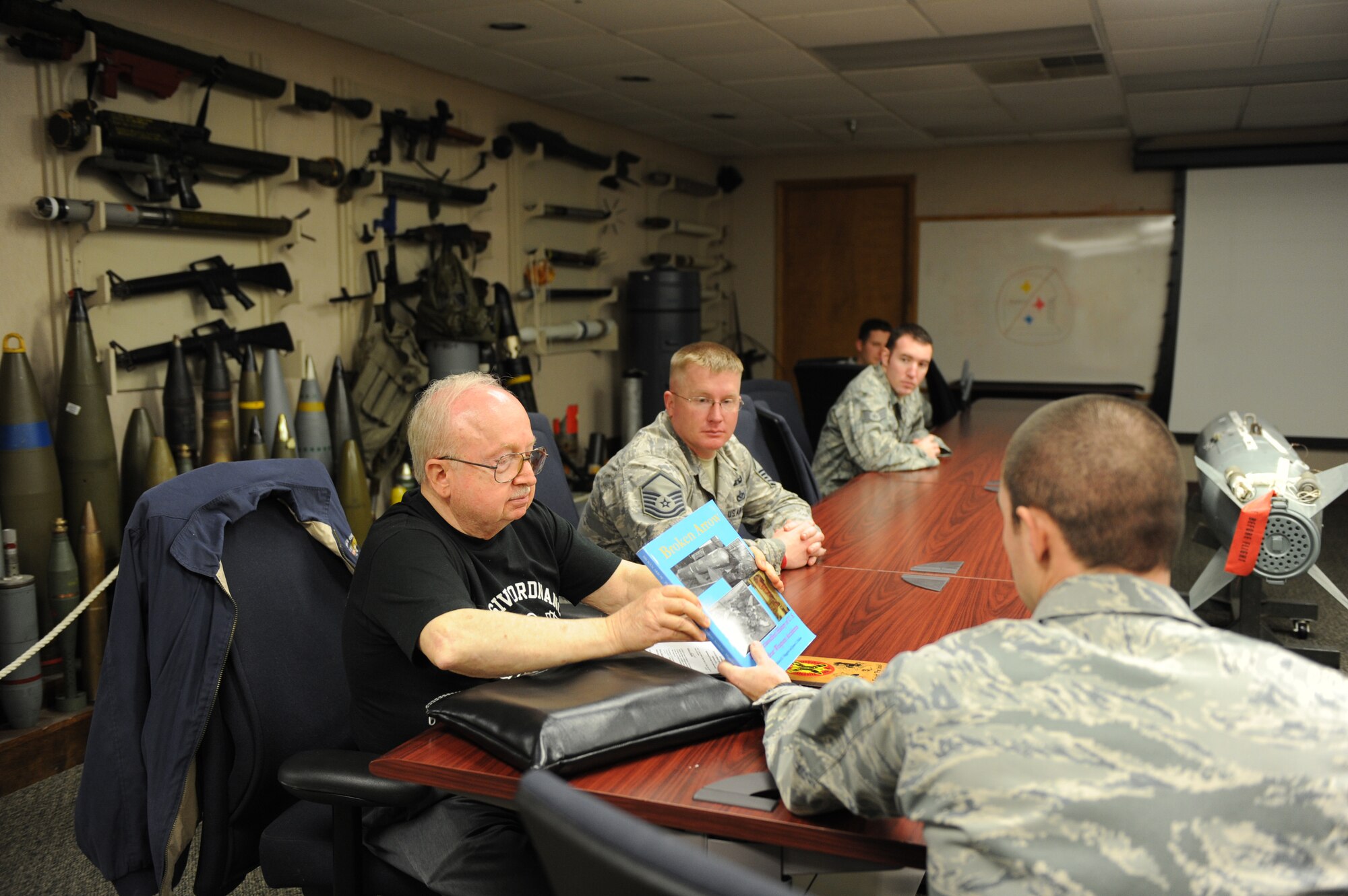 SEYMOUR JOHNSON AIR FORCE BASE, N.C.-- Dr. Jack B. ReVelle shares his experience with members of the 4th Fighter Wing Explosive Ordinance Disposal team during the near-explosive historic event that affected the communities of Goldsboro and Faro 50 years ago here, Feb. 9, 2011. Dr. ReVelle, then a 1st Lieutenant, was the team lead for Detachment 42702 EOD squadron from Wright Patterson AFB, Ohio that responded to the B-52 Crash in Faro. Dr. ReVelle is from Orange, Calif. (U.S. Air Force photo/Staff Sgt. Courtney Richardson) (RELEASED)