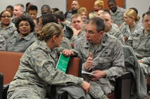 Maj. Shannon Mann, Public Affairs, congratulates Lt. Col. Robert Youngblood, Staff Judge Advocate, on his team's recognition by the AMC IG. Both Public Affairs and JAG were recognized for their performance during the wing's recent inspection. (USAF photo by Ms. Donna Lea, 916ARW/PA)