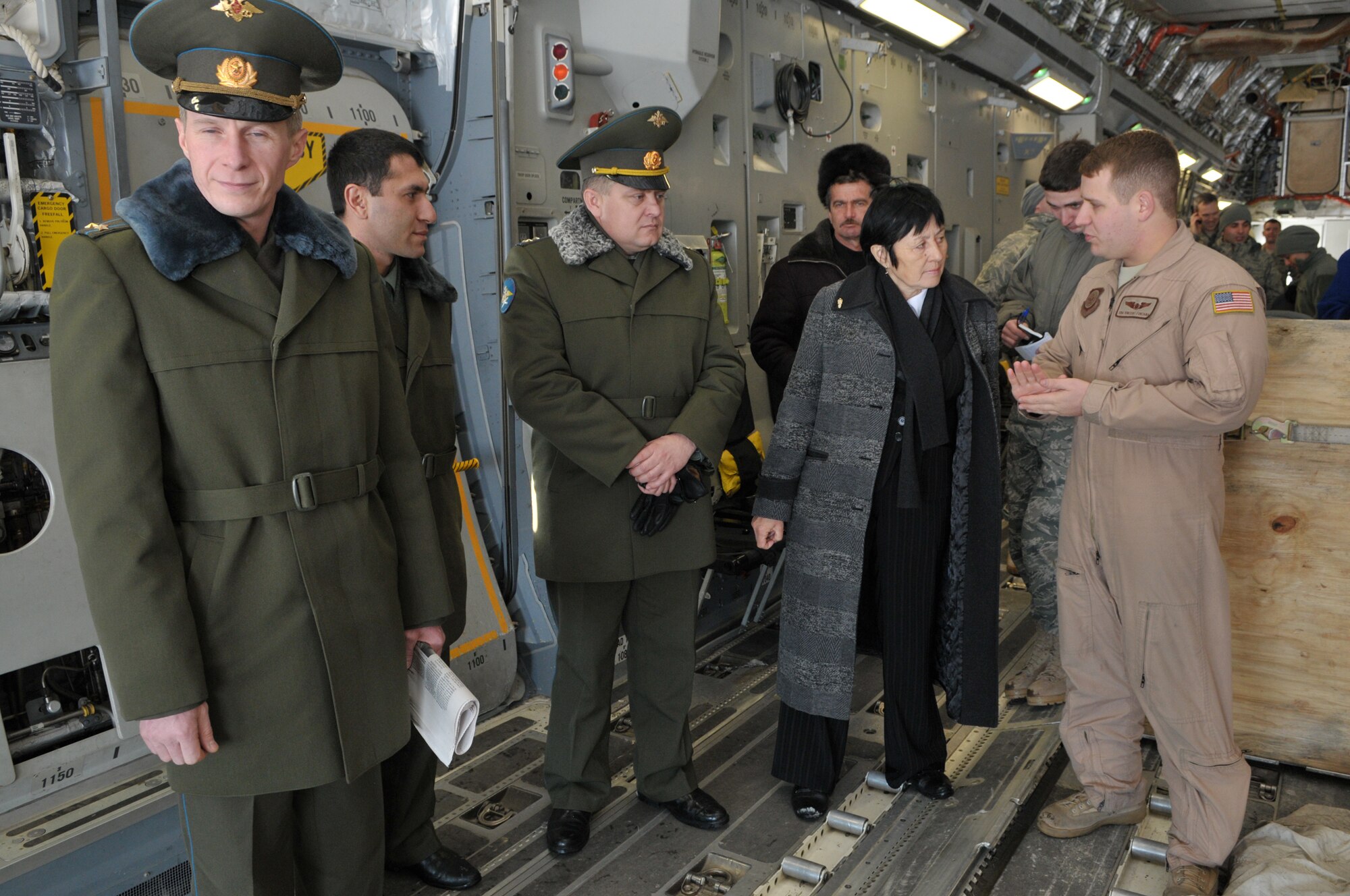 TRANSIT CENTER AT MANAS, Kyrgyzstan -  Members from the Transit Center give a tour of a C-17 Globemaster III to Russian Air Force personnel from Kant Air Base.  This is the first time in Transit Center history that members from Kant have toured here.  This visit gave the Kant Airmen a glimpse of the daily U.S. Military life and operations.(U.S. Air Force photo/Sgt. Stacy Moless)