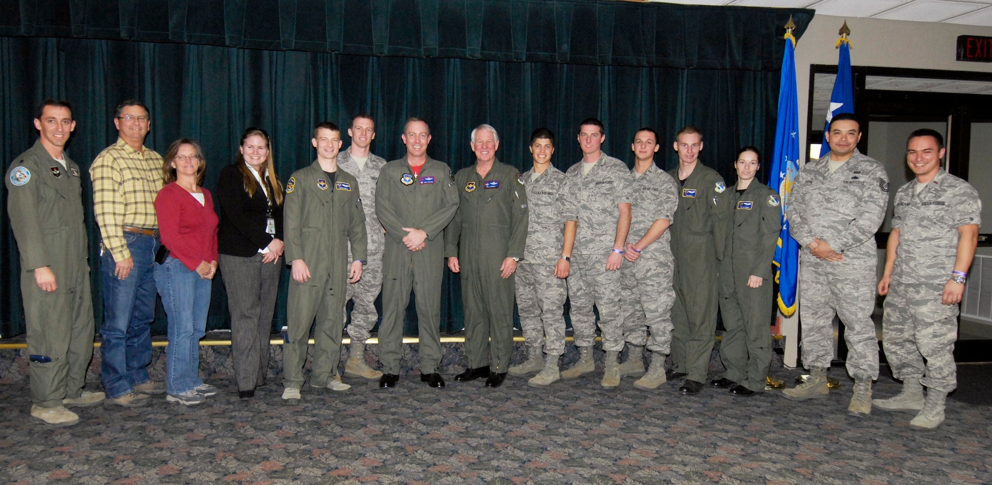 LAUGHLIN AIR FORCE BASE, Texas — Retired Gen. William Looney and Col. Michael Frankel, 47th Flying Training Wing commander pose with Club XL’s bar renovation team. The team includes Lt. Col. William Rhyne, 2nd Lts. Daniel Martin, Zachary Bierhaus, David Dailey, Lucian Dekich, Daniel Huber, Derek Van De Wege and Frank Von Heiland, all of the 47th Operations Support Squadron. Other members represent the 47th Civil Engineering Squadron: Tech. Sgt. Stephen Payne, Glenn Purvis, Amy Morgan and Stephanie Marquez.  (U.S. Air Force photo by Jose Mendoza)