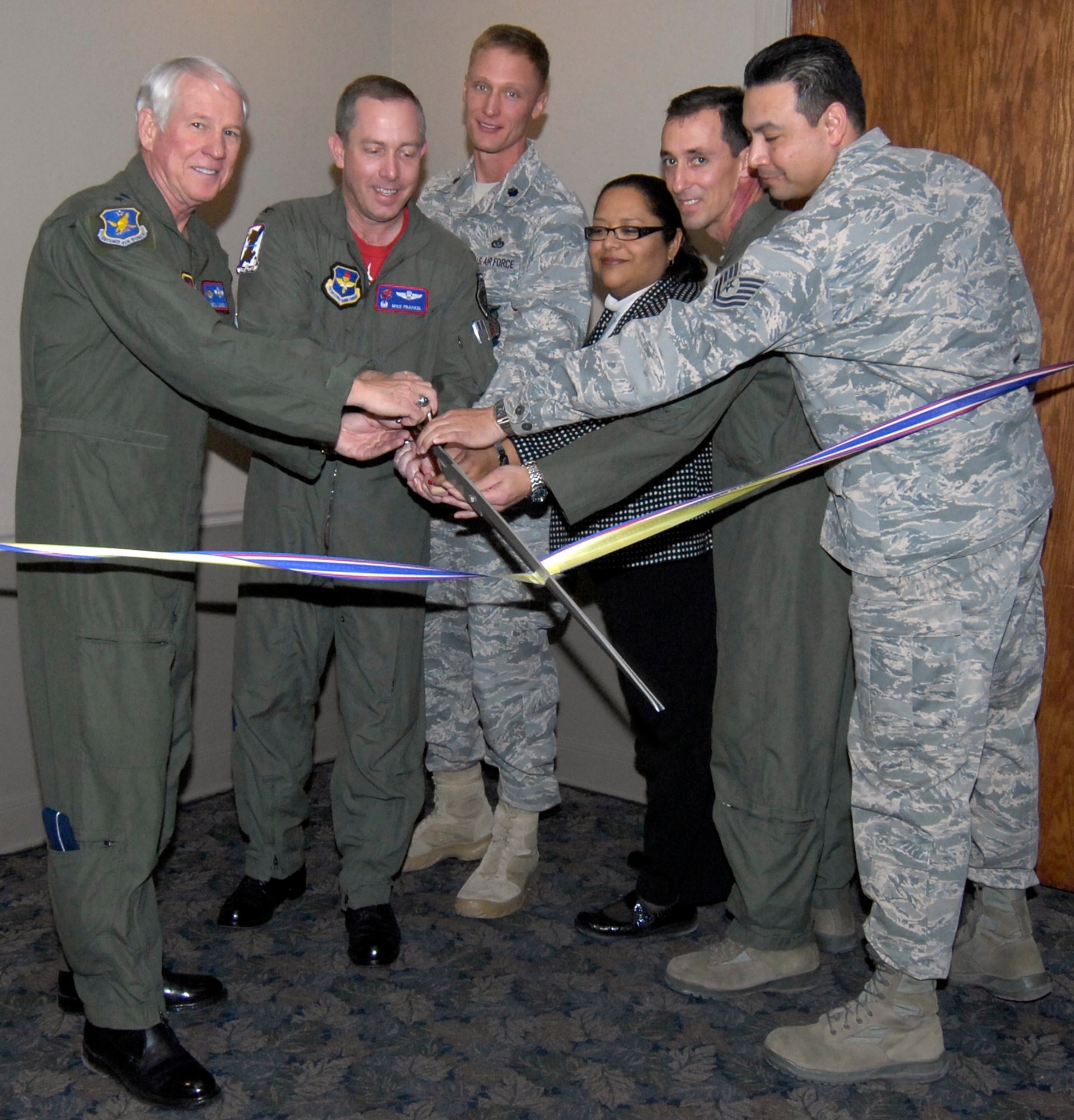 LAUGHLIN AIR FORCE BASE, Texas — Retired Gen. William Looney, Col. Michael Frankel, 47th Flying Training Wing commander, Lt. Col. Dee Katzer, 47th Civil Engineering Squadron commander, Lt. Col. William Rhyne, 47th Operations Support Squadron, Susan Powell, 47th Force Support Squadron and Tech. Sgt. Stephen Payne, 47th CES conduct a ceremonial ribbon cutting during Club XL’s bar grand reopening Feb. 4. (U.S. Air Force photo by Jose Mendoza)