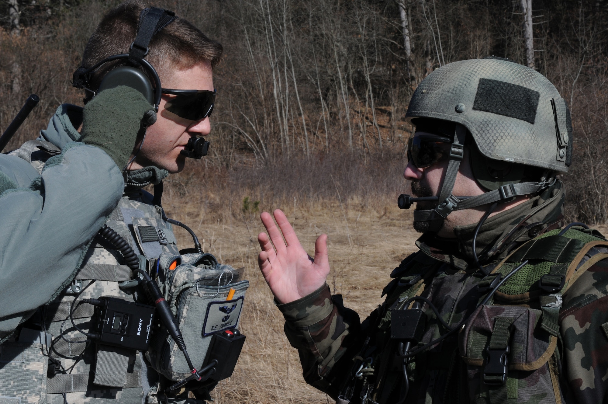 Maj. Bryan Trinkle, 8th Air Operations Support Squadron operations officer and joint terminal attack controller, discusses close air support training scenerios with Slovenian army Sgt. 1st Class Sergej Savov, 1st Brigade tactical air control party leader, during a NATO coalition combat capability training exercise at Pocek Range in Postojna, Slovenia, Feb. 2. The exercise consisted of close air support training between Aviano Air Base, Italy,  and Slovenian army joint terminal attacks controllers and tactical air control party operators as well as Slovenian PC-9M aircraft.(U.S. Air Force Photo/ Staff Sgt. Nadine Y. Barclay)