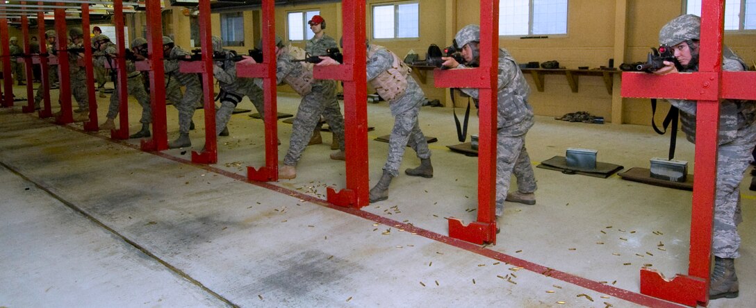 The 11th Security Forces Squadron members perform a tactical rifle qualification course at Combat Arms Training and Maintenance shooting range here Feb. 7. The purpose of the training is to ensure 11 SFS members maintain a high level of proficiency and qualification to perform their duties. (U.S. Air Force photo/Bobby Jones)