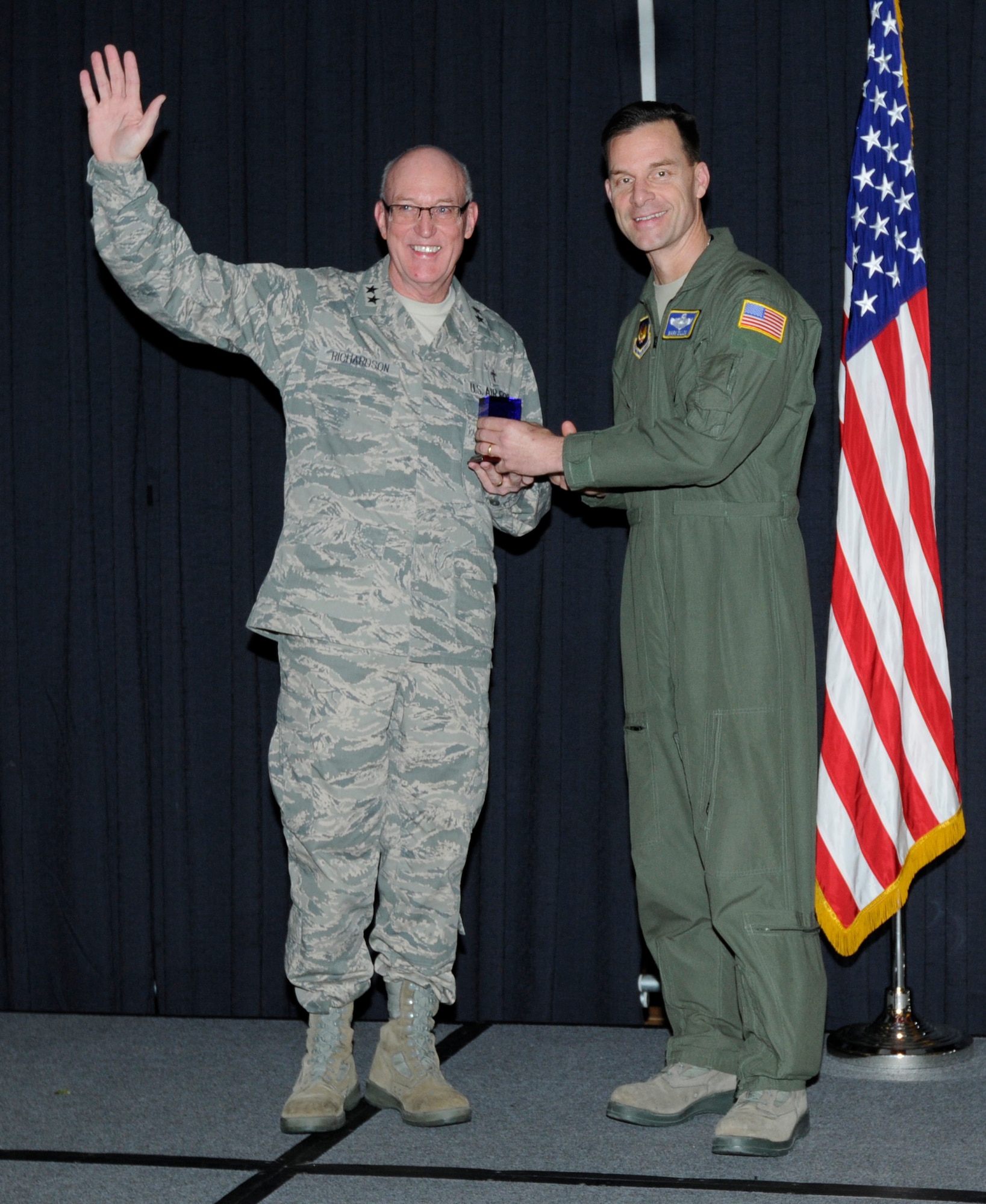 U.S. Air Force Brig. Gen. Mark Dillon, 86th Airlift Wing commander, presents Maj. Gen. Cecil Richardson, U.S. Air Force chief of chaplains, a memento of appreciation for his dedication to the Chaplain's Corps' during a National Prayer Luncheon, Ramstein Air Base, Germany, Feb. 9, 2011. Originally called "Prayer Breakfast", the tradition was established in 1953 by members of the U.S. Senate, U.S. House Prayer Groups and President Dwight D. Eisenhower. (U.S. Air Force photo by Airman Kendra Alba)