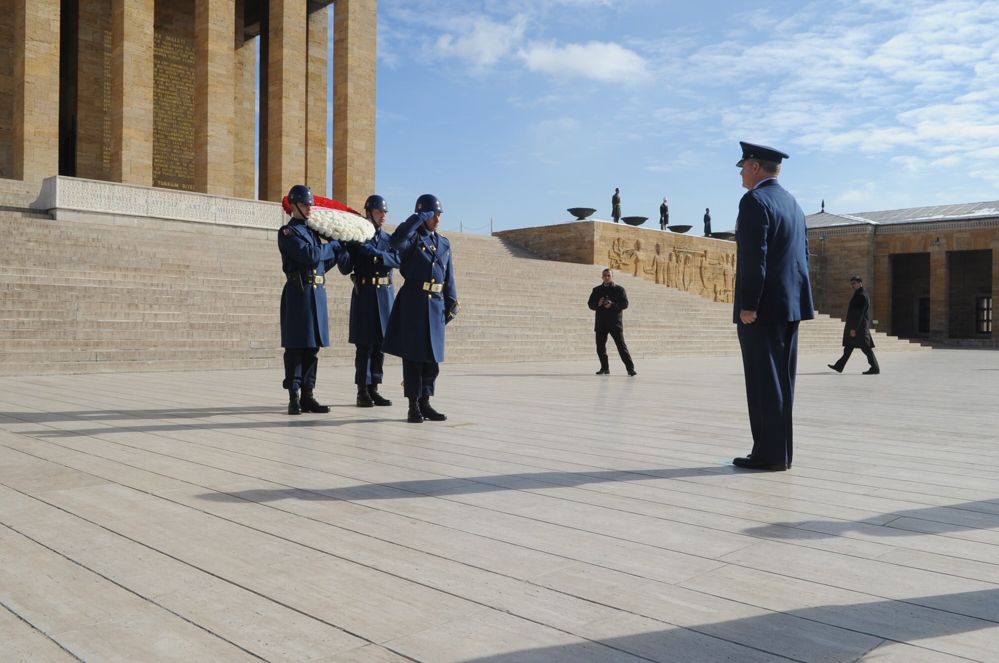 A Turkish service member salutes Gen. Mark A. Welsh III, U.S. Air Forces in Europe commander, at a wreath-laying ceremony, in Ankara, Turkey, Feb. 2, 2011. The ceremony honored Mustafa Kemal Ataturk, the founder of the Republic of Turkey, and took place at Anitkabir, Ataturk’s memorial and mausoleum.  Airmen from local Air Force units accompanied the general to the ceremony. (U.S. Air Force photo by Tech. Sgt. Valda Wilson/Released)