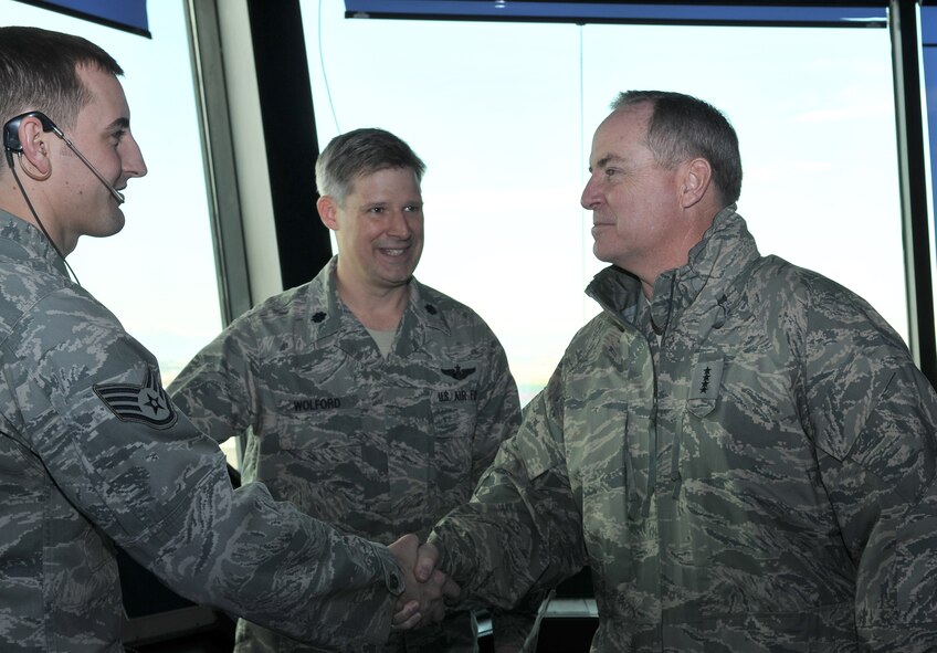 Staff Sgt. Donald Mills from the 39th Operations Squadron is introduced to Gen. Mark A. Welsh III, U.S. Air Forces in Europe commander, by Lt. Col. Bryan Wolford, the commander of the 39th Operations Squadron, in the air traffic control tower, Feb. 4, 2011, at Incirlik Air Base, Turkey. General Welsh visited the base to speak with Airmen and gain insight into how they accomplish the mission of the 39th ABW. During his visit, the general emphasized the importance of each Airman to the mission and said how impressed he is with the work Airmen at Incirlik AB are doing. (U.S. Air Force photo by Staff Sgt. Alex Montes/released)
