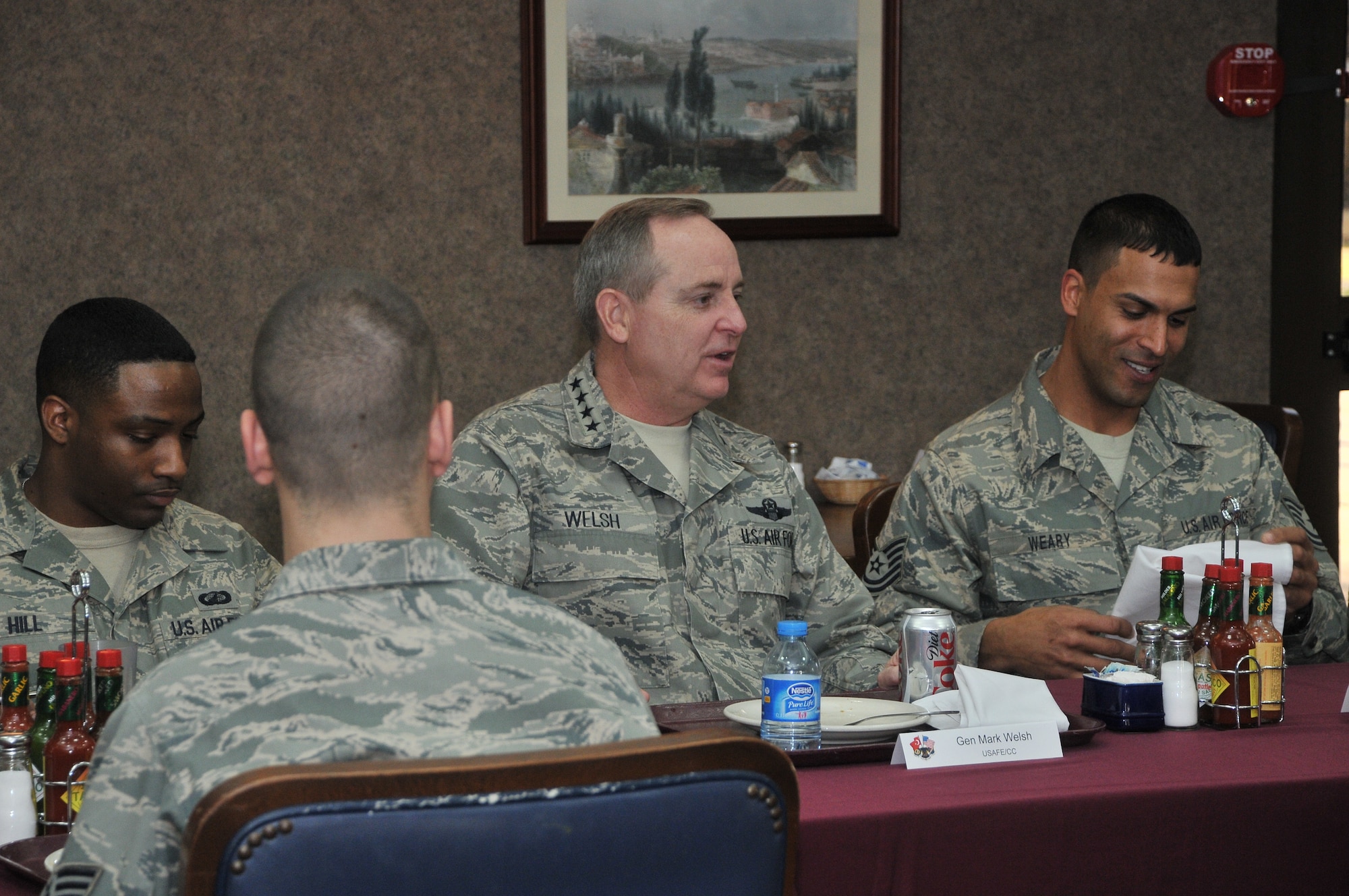 Gen. Mark A. Welsh III, U.S. Air Forces in Europe commander, sits with Staff Sgt. Chad Hill from the 39th Comptroller Squadron and Tech. Sgt. Alan Weary from the 39th Medical Support Squadron during an Airmen’s breakfast, Feb. 3, 2011, at Incirlik Air Base, Turkey.  General Welsh visited the base to speak with Airmen and gain insight into how they accomplish the mission of the 39th ABW. (U.S. Air Force photo by Staff Sgt. Alex Montes/released)