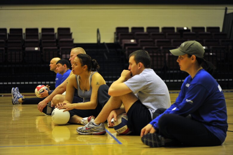 Air Force Warrior Team training camp attendees listen to their coach speak during volleyball practice Feb. 9, 2011, at the Blossom Athletic Center in San Antonio, Texas. There are a total of 32 athletes invited to the 2011 Air Force Warrior Team training camp Feb. 7 through 11 in San Antonio. (U.S. Air Force photo/Staff Sgt. Desiree N. Palacios)