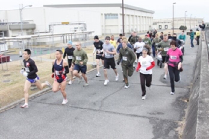Nobuhisa Tanigawa, the 2011 Gokukan 5 kilometer Run winner, and Touru Tanoue, the runner-up, lead the other competitors as the race started behind the IronWorks Gym here Feb. 11. Tanigawa finshed the run with the best time of 18:09 and Tanoue only seconds behind; however, every competitor completed the extreme cold race.