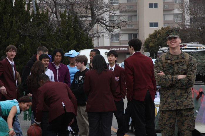 Cpl. Michael A. Clemens, Marine Aircraft Group 12 special intelligence communications center noncommissioned officer in charge, volunteers for the 2010 - 2011 Matthew C. Perry homecoming parade here Feb. 11. Clemens volunteered approximately 300 hours to receive the United Service Organizations Japan Service Salute Award during an award ceremony for U.S. and Japanese service members in Tokyo Sept. 17.