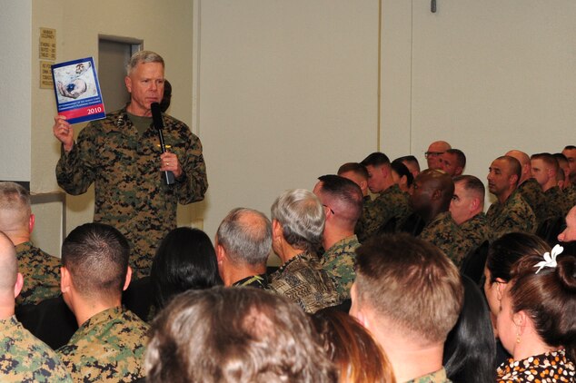Gen. James F. Amos, 35th commandant of the Marine Corps, speaks to approximately 2,000 Marines with 3rd Marine Regiment during a visit to Marine Corps Base Hawaii with Sgt. Maj. Carlton W. Kent, sergeant major of the Marine Corps, Feb. 10, 2011. During their visit, the leaders spoke about and answered questions concerning the Corps’ continued involvement in overseas operations, reduction in personnel, the future of certain military occupational specialties, and issues surrounding the recent repeal of the Department of Defense’s “Don’t Ask, Don’t Tell” policy. For Amos, who began his career as a first lieutenant with a Hawaii-based squadron, the visit to Hawaii was his first as commandant.