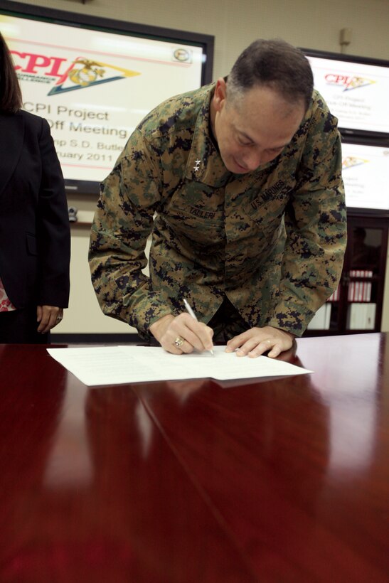 Maj. Gen. Peter J. Talleri, commanding general, Marine Corps Base Camp Butler, signs the third project execution letter for the Continuous Process Improvement Plan Feb. 11.
