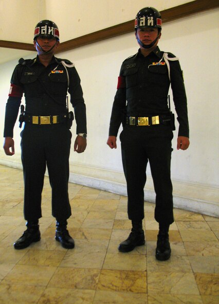 Pipat Kangatitan, a security volunteer, and Thai Army 1st Sgt. Waranut Prasck stand guard on the sixth floor of a local hotel during Exercise Cobra Gold 2011. Both said they are proud to have the responsibility of keeping all Cobra Gold participants safe. (U.S. Air Force photo/1st Lt. Jason Smith)