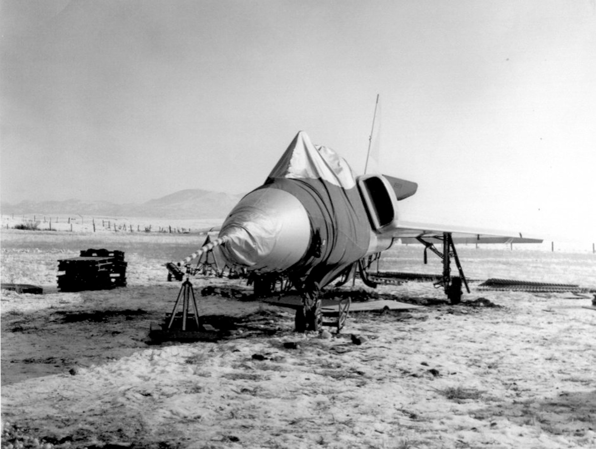 PLANE LANDS ITSELF AFTER PILOT EJECTS - This F-106A (S/N 58-0787) was involved in an unusual incident. During a training mission, it entered an flat spin forcing the pilot to eject. Unpiloted, the aircraft recovered on its own and miraculously made a gentle belly landing in a snow-covered field. (U.S. Air Force photo)