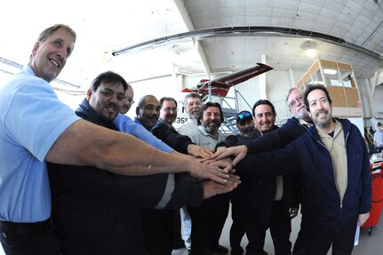 (From Left) Dan Fries, Michael Monsalvo, Christopher McGurgan, Tony Baretto, Jerry Villareal, Larry Welfel, Al Limas, Glenn Dries, Richard Morales, Chuck Rehome and Ignacio Escobedo, all members of 12th Flying Training Wing maintenance division, gathered in Hangar 3 for safety briefings and discussions during Wingman Day at Randolph Air Force Base, Texas, Feb. 11. (U.S. Air Force photo/Rich McFadden)