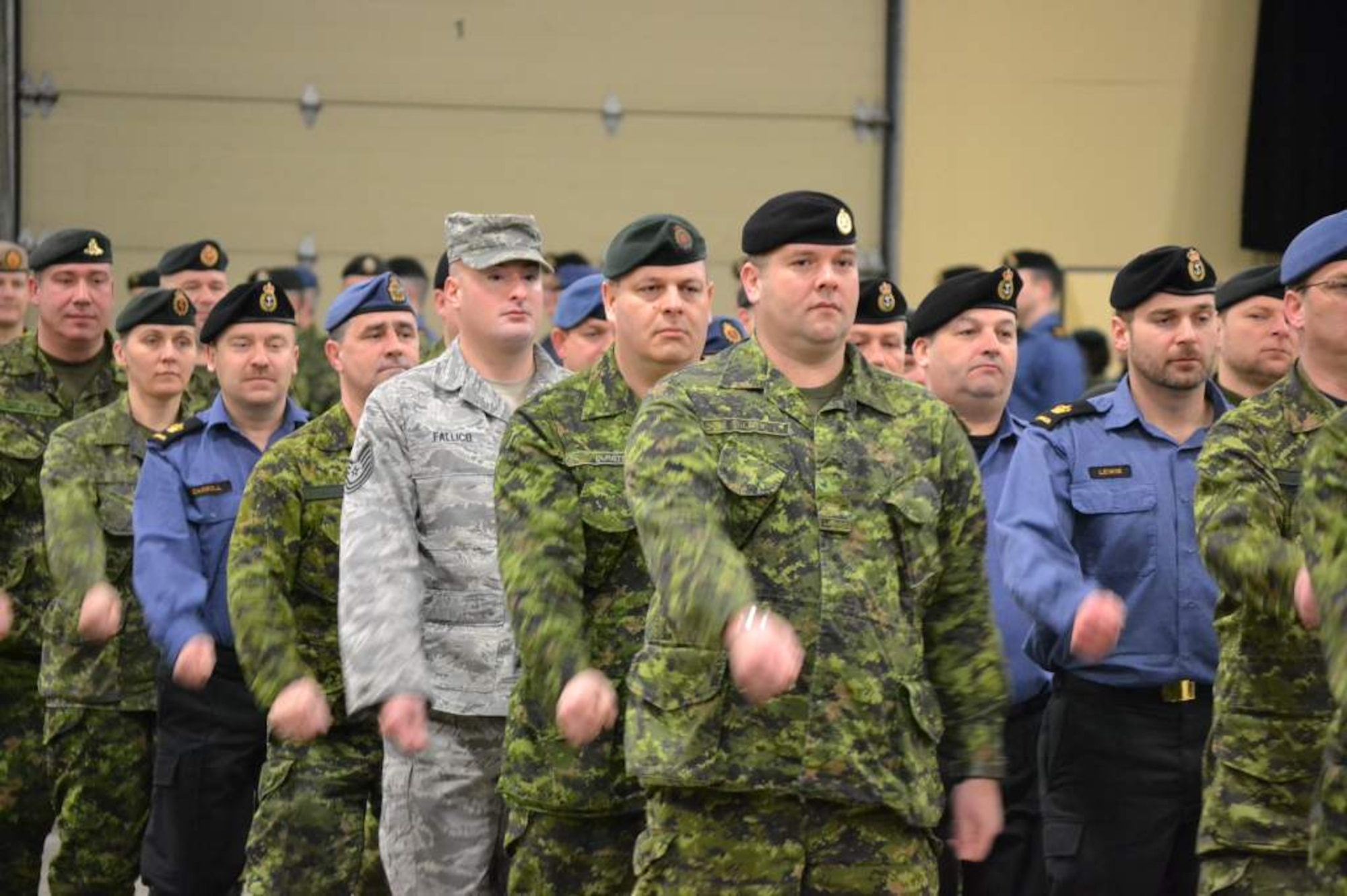 U.S. Air Force Tech. Sgt. Clifford Fallico, Air Forces Northern intelligence, surveillance and reconnaissance planner,  marches in formation at the Canadian Intermediate Leadership program at the Canadian Forces College, Noncommissioned Member Professional Development Center, St. Jean Sur Richelieu in Quebec Canada. (Photo by Chief Petty Officer 2 Frank Lauzier)