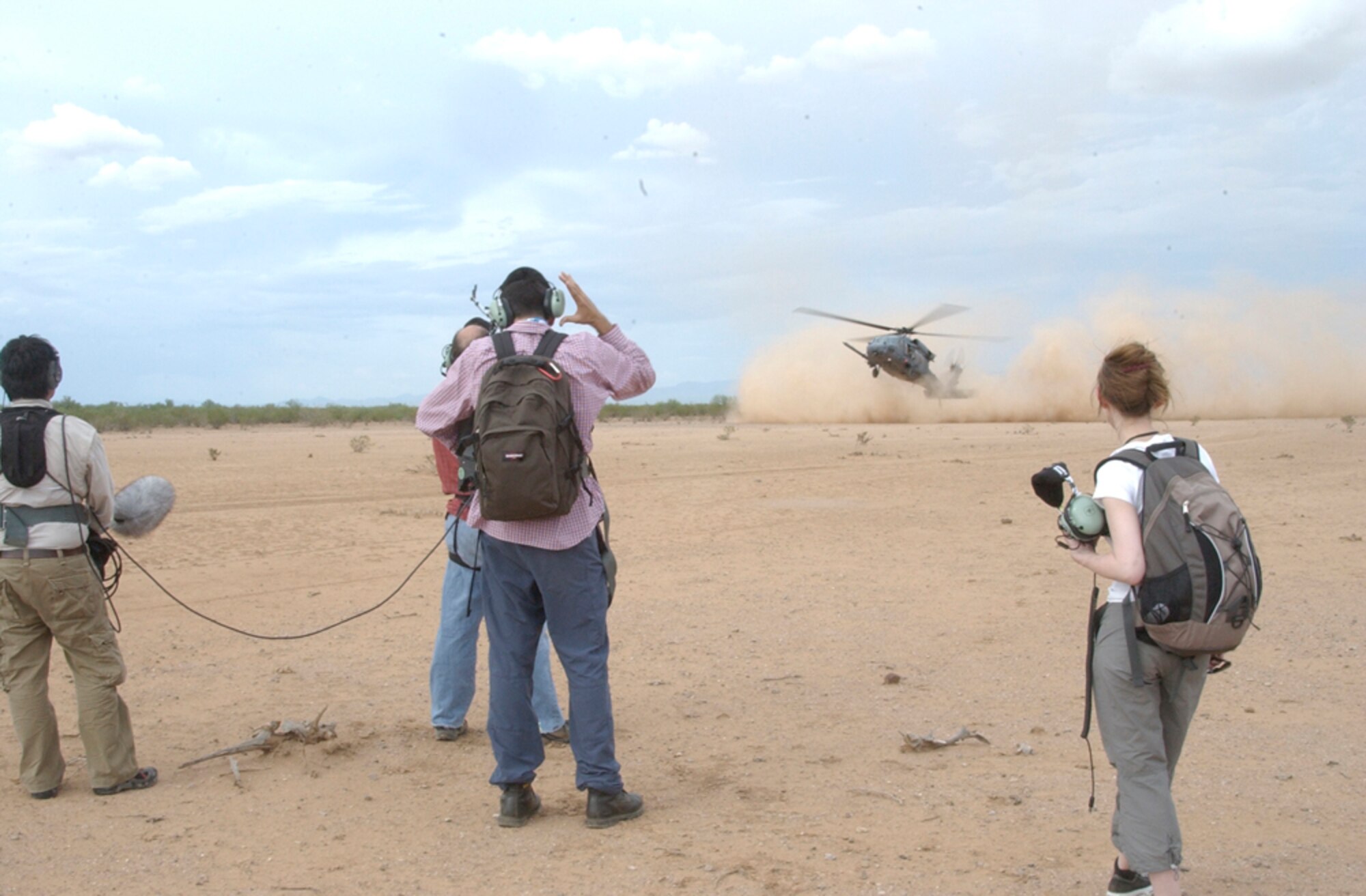 DAVIS-MONTHAN AIR FORCE BASE, Ariz. - Air Force Reserve Airmen from the 920th Rescue Wing, Patrick Air Force Base, Fla., as well as from their geographically separated unit, the 943rd Rescue Group here, are featured for their heroics in a newly released documentary titled, ?The Taliban Gambit,? which will be airing on the Smithsonian Channel throughout December 2010.  Shown here, the London-based Windfall Film crew, film various scenes in the Tuscon desert in July 2008. (U.S. Air Force photo/Capt. Cathleen Snow)