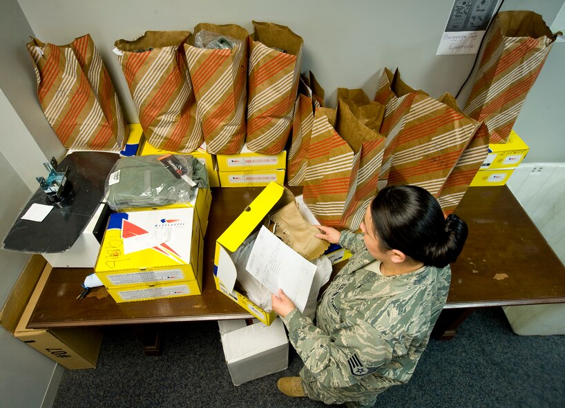 Staff Sgt. Belinda Martinez, 2nd Logistics Readiness Squadron unit deployment manager, prepares back order supplies to be shipped to deployed Airmen on Barksdale Air Force Base, La., Feb. 11. Due to the high number of deployed personnel, the demand for supplies sometimes outweighs the supply and the equipment must be sent when the supplies are ready. (U.S. Air Force photo/Senior Airman Chad Warren)(RELEASED)