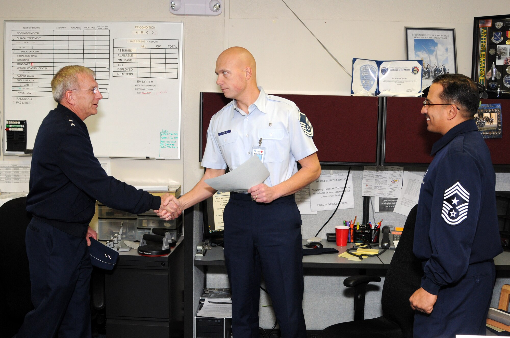 The 72nd Medical Group’s Tech. Sgt. Drue Lynch was surprised with a promotion Feb. 7, which he was awarded through the Air Force Materiel Command’s Stripes for Exceptional Performance program. Oklahoma City Air Logistics Center Commander Maj. Gen. David Gillett, left, presented the stripes to Sergeant Lynch along with Command Chief Master Sgt. Kevin Vegas, right. There are only a few STEP?promotions granted by the command each year. (Air Force photo by Dave Faytinger)

“Drue has been a visible leader across the installation and is not only a highly-skilled technical expert in his career field, but he was also an extraordinary instructor at our Airman Leadership School. Sergeant Lynch’s hard work, dedication, professionalism and mentorship of our young Airmen are indeed keys to his success,” said 72nd Air Base Wing Commander Col. Bob LaBrutta (Air Force photo by Dave Faytinger)
