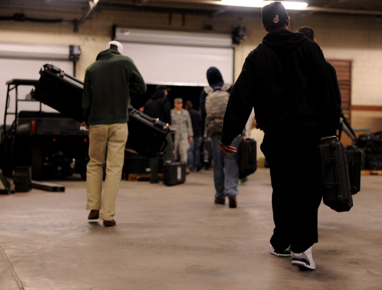 MOODY AIR FORCE BASE, Ga. -- Airmen from the 823rd Base Defense Squadron load their gear onto a trailer before departing to Fort Bragg, N.C., to participate in a joint forces exercise Feb. 10. Members of the 823rd BDS will spend 72 straight hours in the field during the exercise. (U.S. Air Force photo/Airman 1st Class Benjamin Wiseman)(RELEASED)