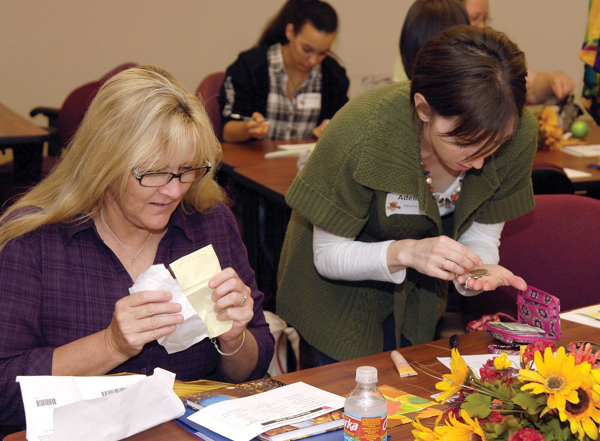 New military spouses participate in a purse scavenger hunt during the last Heart Link at the Airman and Family Readiness Center. The next Heart Link class will be held Feb. 22 at the A&FRC in Bldg. 6001. (Air Force photo by Margo Wright)