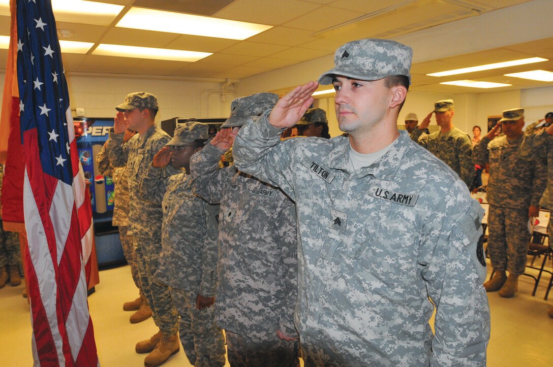 Sgt. Christopher Tilton salutes the flag during the playing of the national anthem during a deployment ceremony Feb. 2 for Soldiers assigned to the 510th Human Resources Company, Special Troops Battalion, 7th Sustainment Brigade. The HRC team is deployed to Afghanistan in support of Operation Enduring Freedom.

