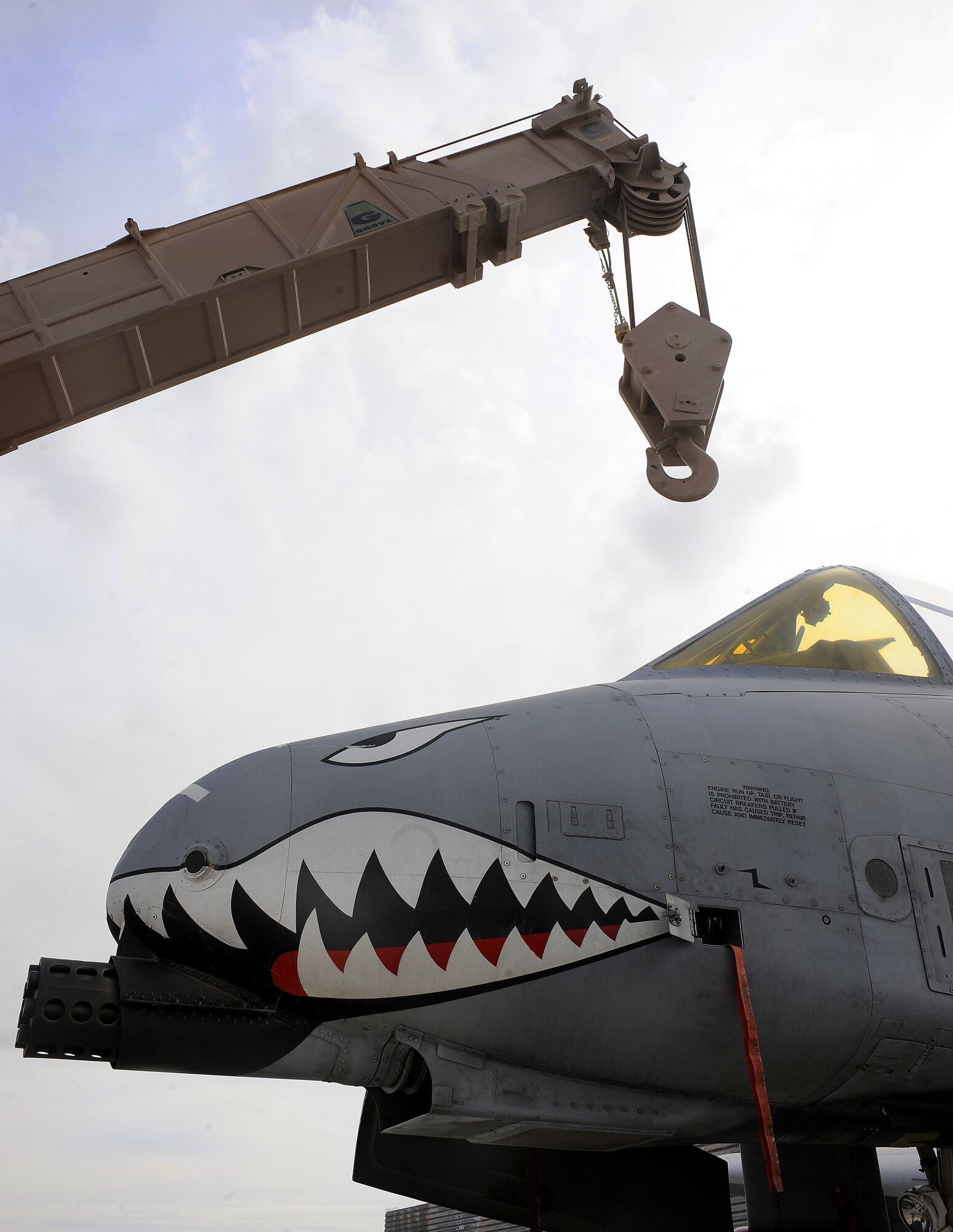 Staff Sgt. Nicholas Blucker positions a 60-ton crane boom to prepare for an A-10C Thunderbolt lift exercise Feb. 9, 2011, at Kandahar Airfield, Afghanistan. The 451st Air Expeditionary Wing?s crash recovery team is responsible for all American aircraft with in-flight emergencies on the airfield. Sergeant Blucker is a crash recovery technician assigned to the 451st Expeditionary Maintenance Squadron. (U.S. Air Force photo/Senior Airman Willard E. Grande II/Released)