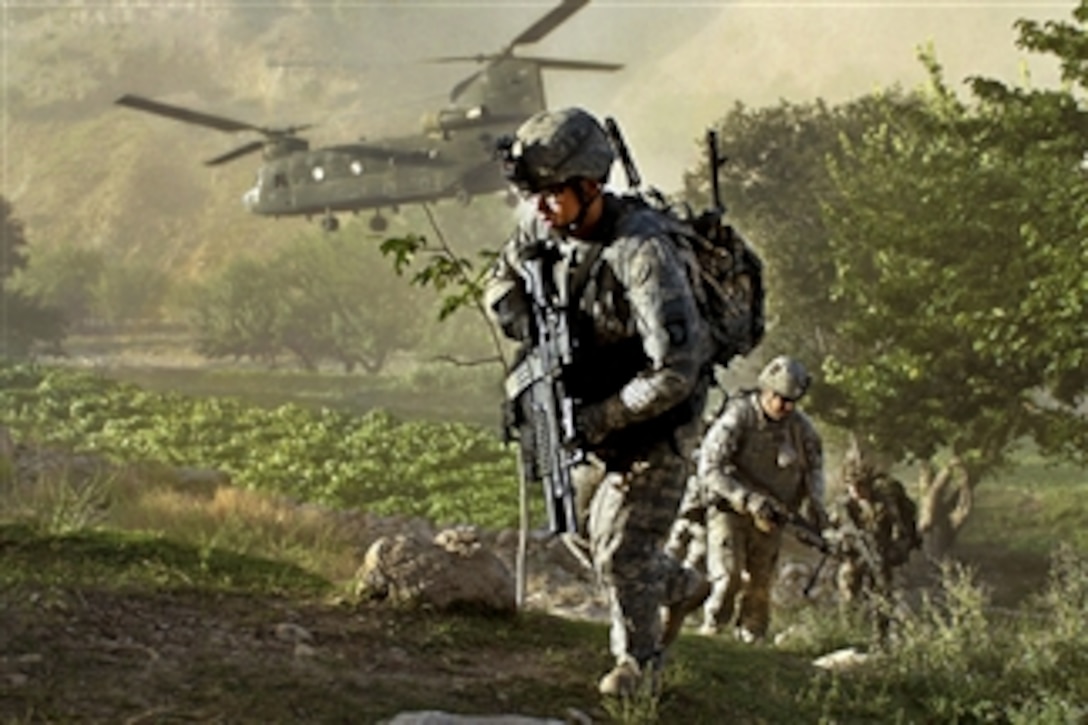 U.S. Army soldiers air assault from a CH-47 Chinook helicopter into a village inside Jowlzak valley in Afghanistan's Parwan province on Feb. 3, 2011.  The soldiers, assigned to the 101st Division's Special Troop Battalion, Company A, and Afghan police searched the village while soldiers provided security and met with leaders.  