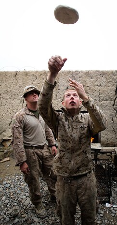Cooks at Patrol Base Gorgak, home of Weapons Company, 2nd Battalion, 1st Marine Regiment, prepare pizza for the Marines, Feb. 11. The cooks like to provide the Marines with at least one home-cooked meal per day day. Patrol Base Gorgak is in Garmsir District, Helmand province, Afghanistan.