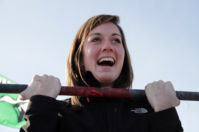 A Hockey Day Minnesota attendee participates in the Marine Corps flexed-arm hang challenge Feb. 12. Throughout the day, dozens of people visited the Marine booth to interact with Fargo recruiters and take a picture next to the Marine Corps Hummer.