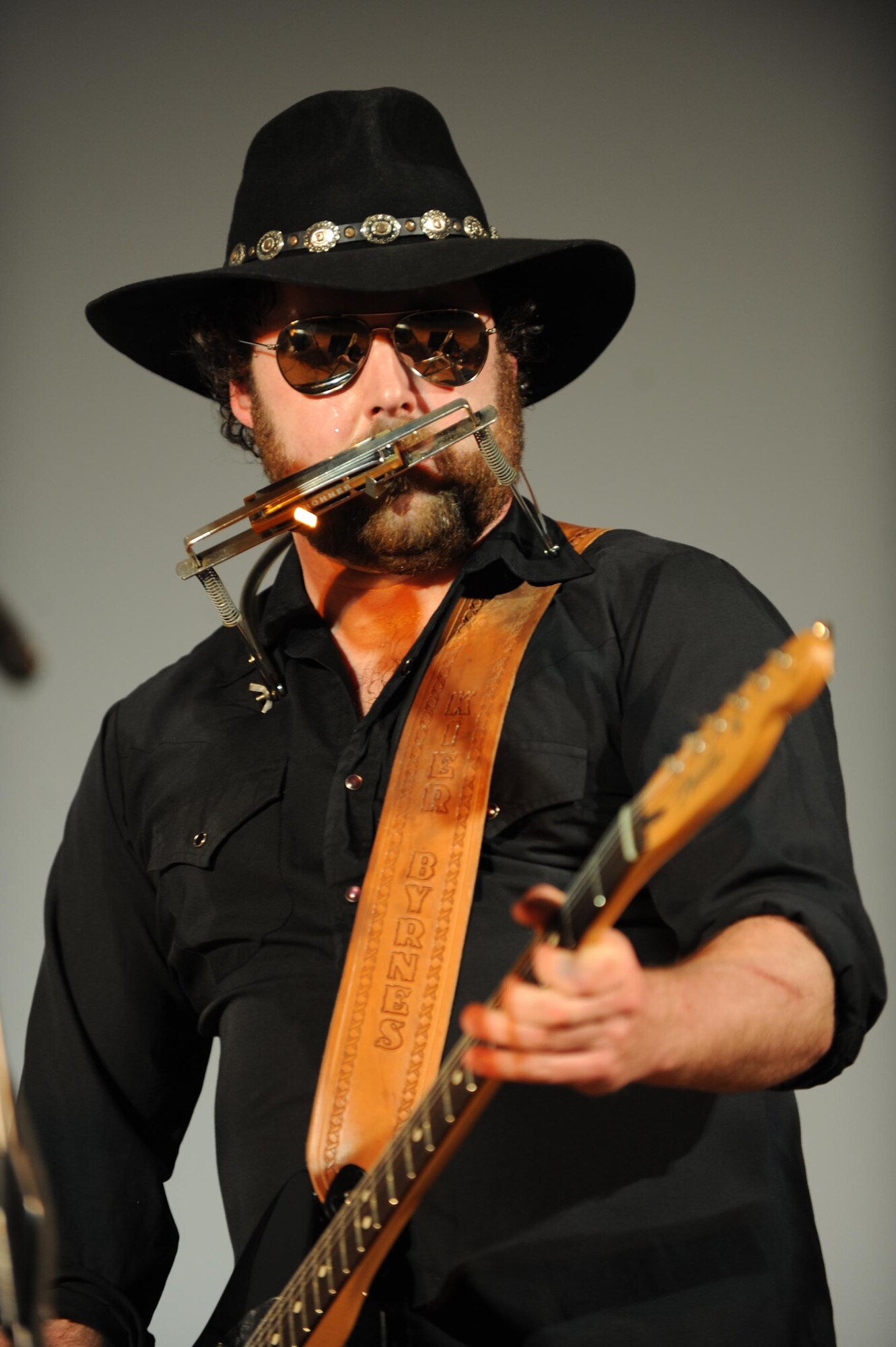 Kier Byrnes, guitarist and vocalist with Three Day Threshold, performs for the members of the 386th Air Expeditionary Wing during a concert Feb. 9. Three Day Threshold, the Boston-based band, stopped at The Rock as part of their Armed Forces Entertainment tour through the Air Force Central Command Area of Responsibility. (U.S. Air Force photo by Senior Airman Cynthia Spalding)