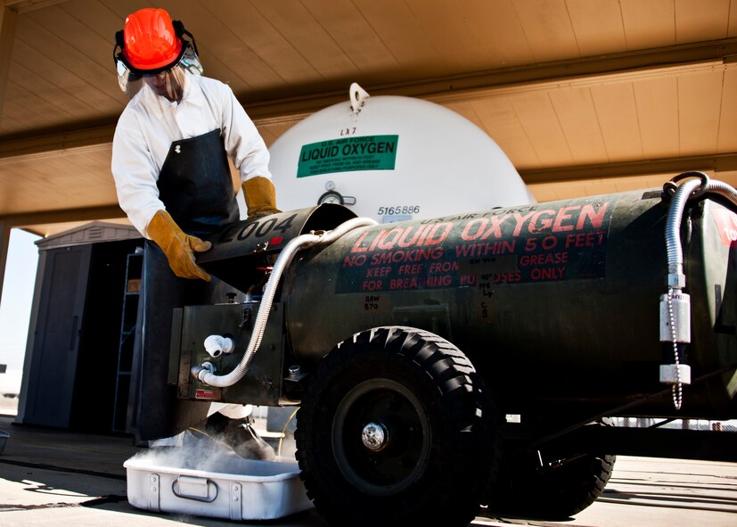 Tech. Sgt. Terence Ladd, 96th Logistics Readiness Squadron, closes the lid of the liquid oxygen refueler after filling it up at Duke Field Feb. 11.  The tanks will be picked up and taken to the flight line to refuel the oxygen tanks on the 919th Special Operations Wing MC-130E Talons.  (U.S. Air Force photo/Tech. Sgt. Samuel King Jr.)