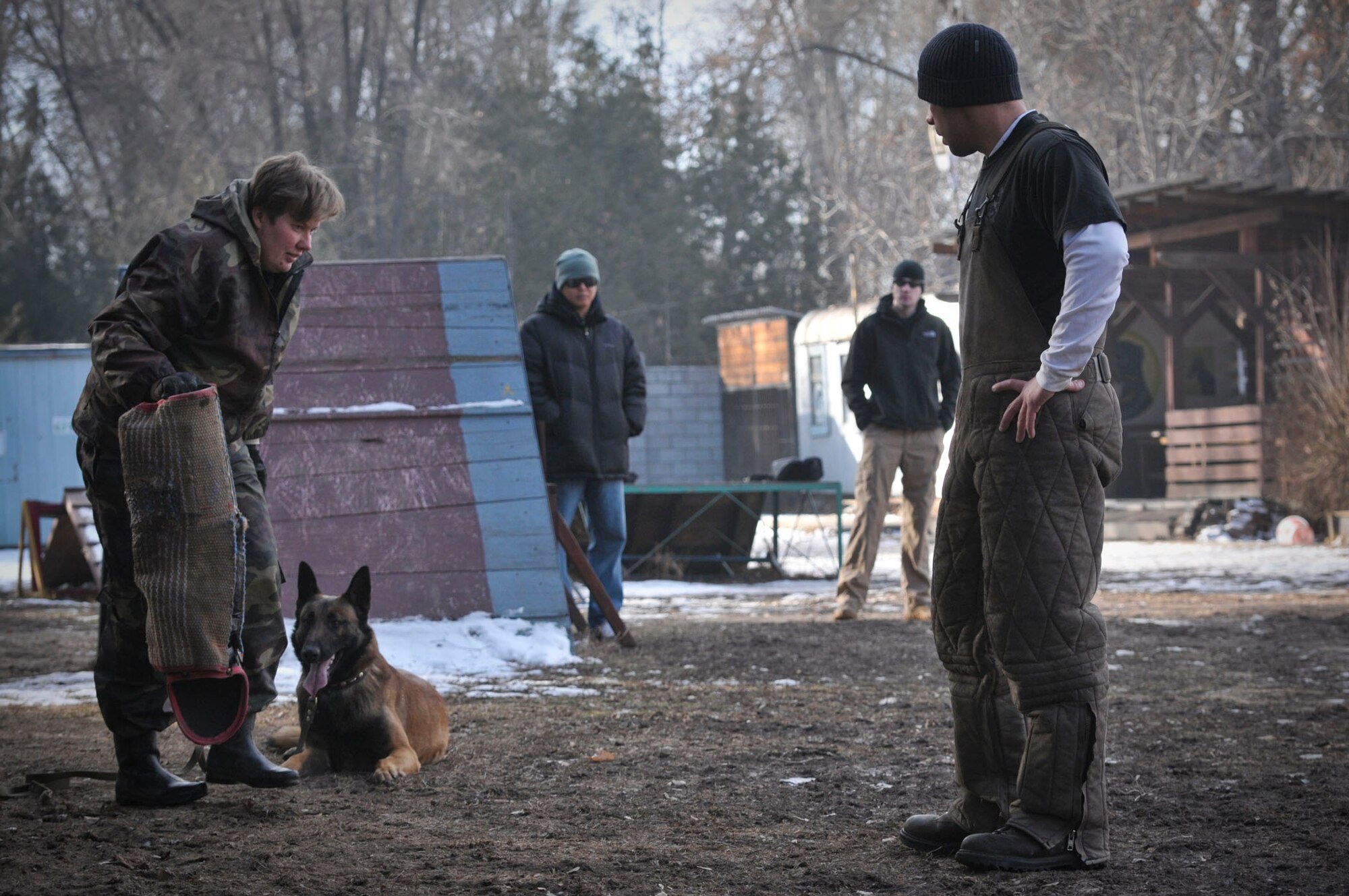 TRANSIT CENTER AT MANAS, Kyrgyzstan -  A Member of Bakyt National Security gets ready to train her dog to listen to her commands as a part of a military to military information exchange Feb. 11. Joseph Villalobos, a K-9 Member from the Transit Center here, trains with Kyrgyz military members in order to learn from each other and foster good working relationships.  (U.S. Air Force photo/Staff Sgt. Stacy Moless)